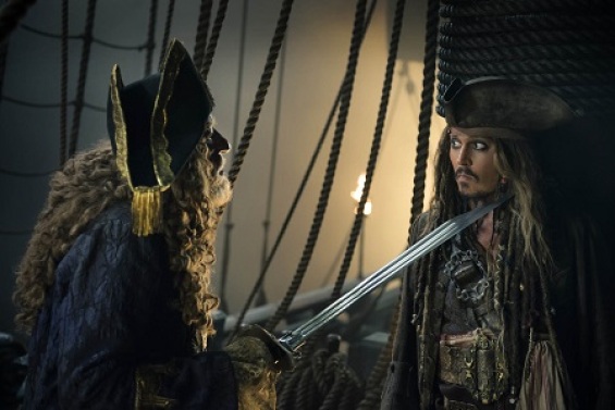 "PIRATES OF THE CARIBBEAN: DEAD MEN TELL NO TALES"..The villainous Captain Salazar (Javier Bardem) pursues Jack Sparrow (Johnny Depp) as he searches for the trident used by Poseidon..Pictured L-R: Geoffrey Rush (Barbossa) and Johnny Depp (Captain Jack Sparrow)..Ph: Peter Mountain..© Disney Enterprises, Inc. All Rights Reserved.